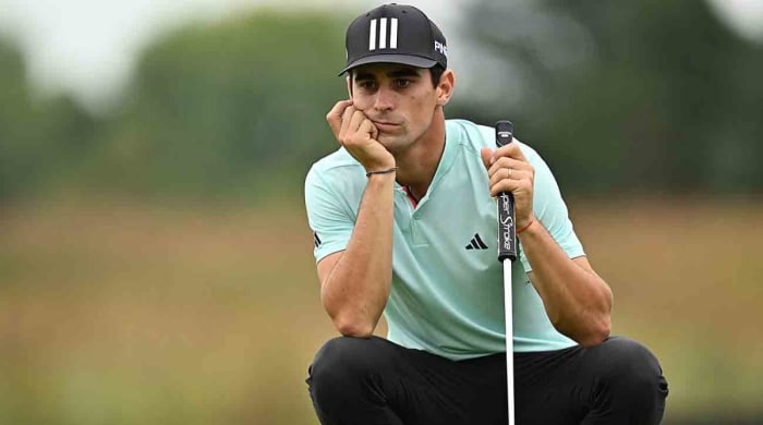 Joaquin Niemann lines up a putt on the 14th green during the first round of the 2023 LIV Golf Chicago golf tournament at Rich Harvest Farms.
